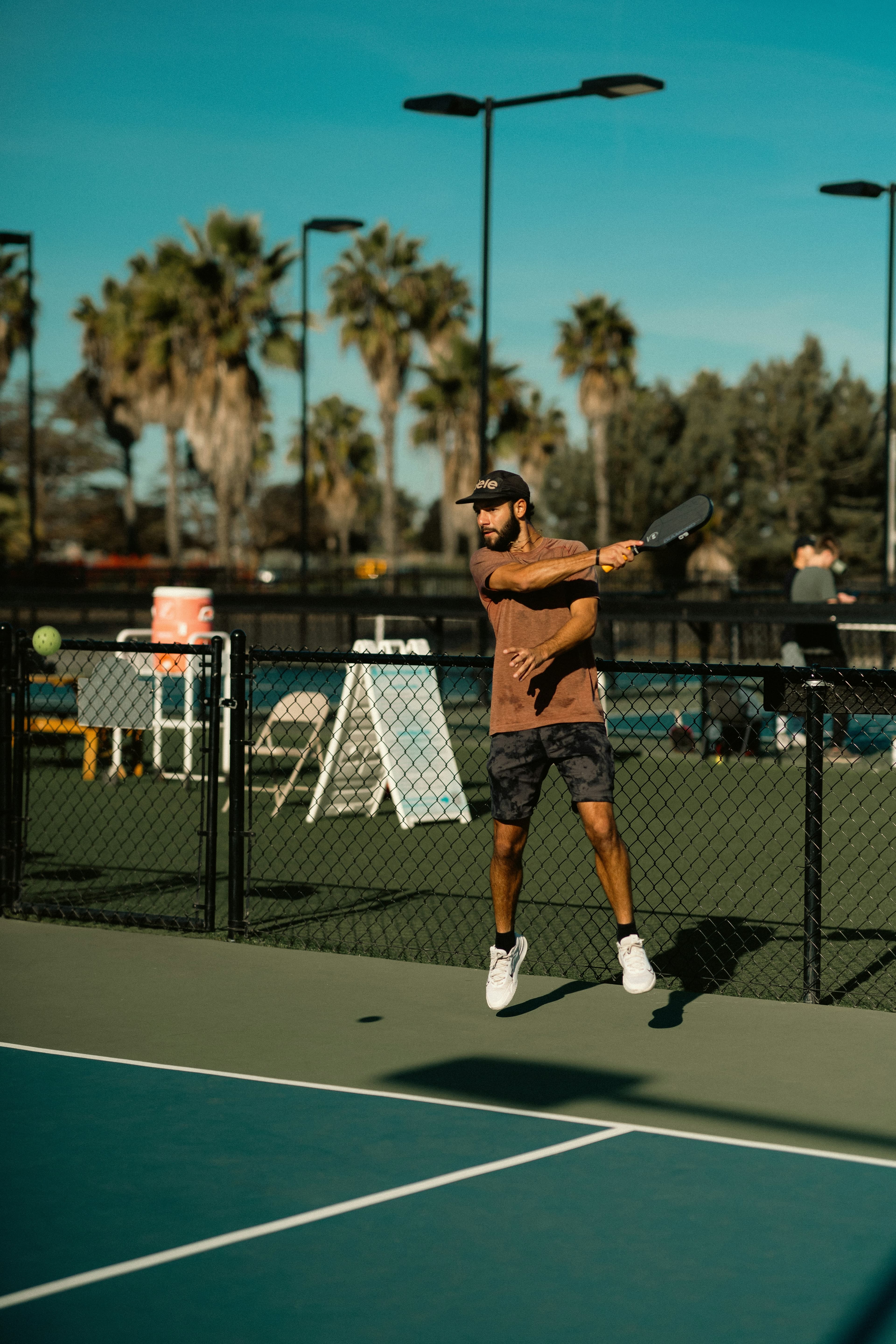 Pickleball player hitting